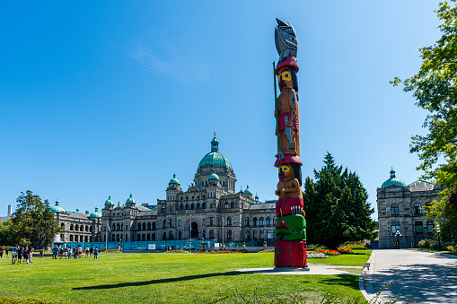 parliament building and a totem pole in Victoria