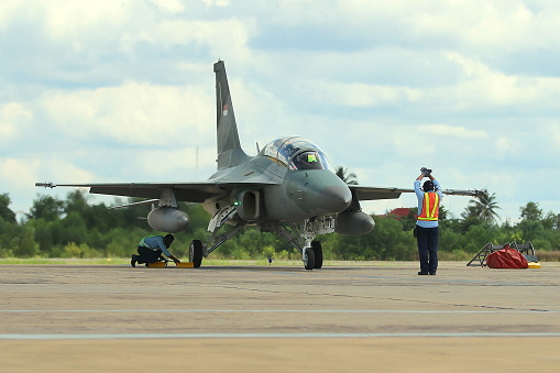 Palangka Raya City, Central Kalimantan Province, Indonesia - June 2, 2016 - Officers check the airworthiness of a fighter jet before flying at Tjilik Riwut Airport, Palangka Raya City, Central Kalimantan Province, Indonesia.