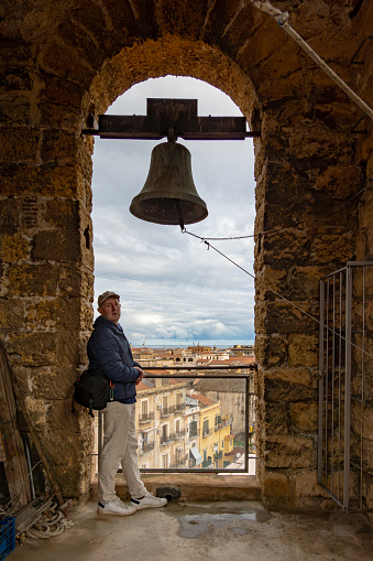 Palermo, Sicily, Italy A man in the bell tower of  the Carmine Maggiore Church.