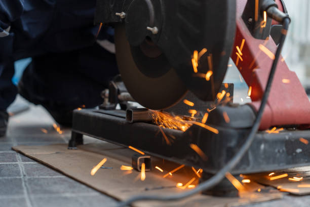 istock Worker uses a steel cutting (circular saw) industry machine to cut steel. 1985160980