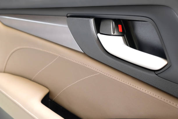 istock Car door handle. Car door inside with door handle. close-up view 1985168302