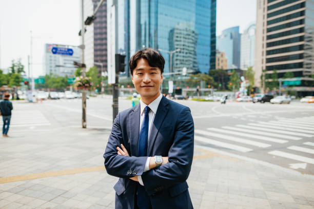 istock Korean businessman in full suit looking at camera 1985173034