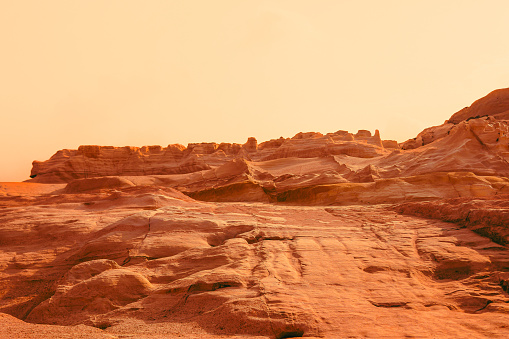 A martian view like a red planet with an arid landscape, rocky hills for space exploration, and science fiction backgrounds