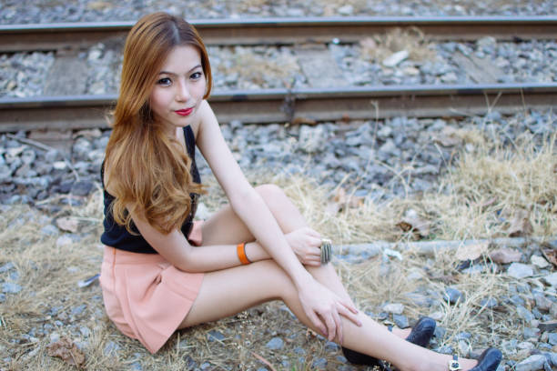 The Asian teenage girl resting at home on the sofa