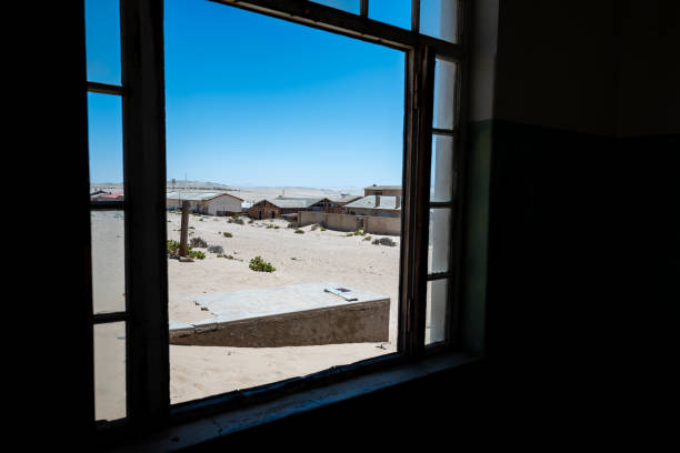 istock Abandoned buildings in a sandy desert 1985188337