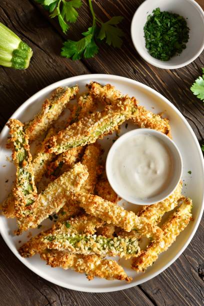 istock Crunchy zucchini breaded sticks served with dip sauce 1985200425