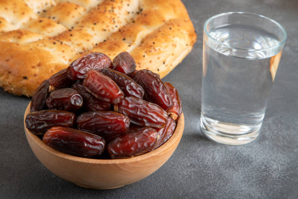 istock Traditional iftar table with dates fruit,olive and ramadan pita 1985205656