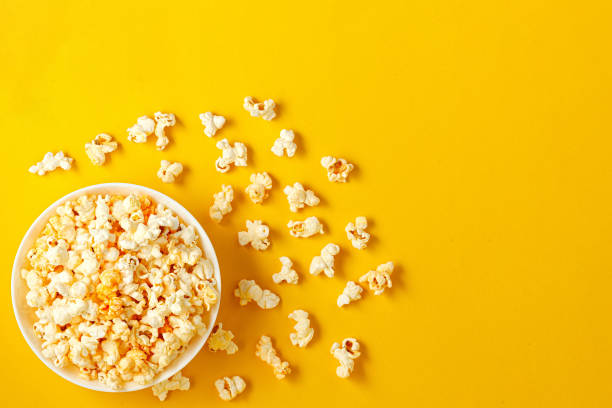 istock plate with popcorn on a yellow background 1985216866