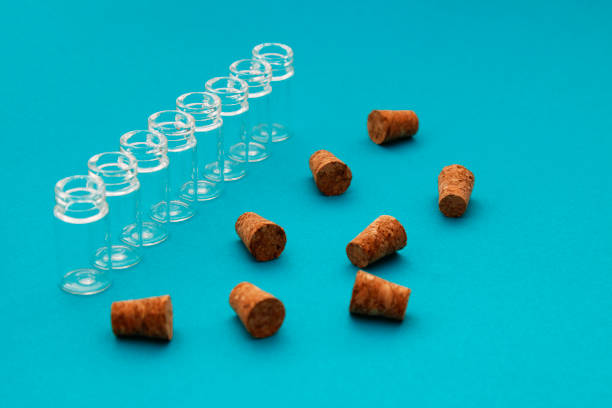 Multiple glass bottles sealed with cork stoppers