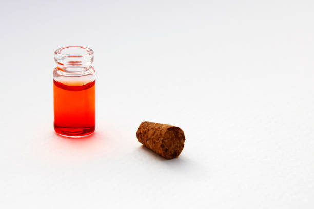 Uncovered glass bottle with orange ink