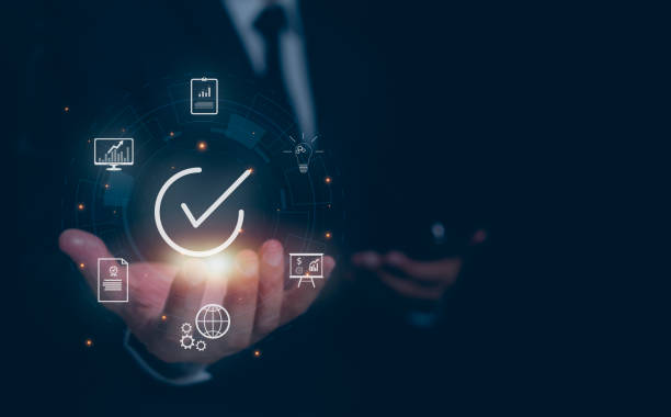 istock Businessman with guarantee check for client service. Client service and guarantee checkmark in business automation, quality management, online shopping, business automation, and financial ecosystem. 1985223221