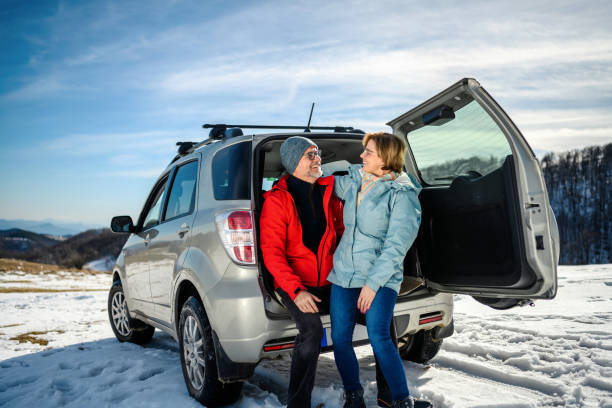 istock Happy loving couple relaxing in car trunk 1985245679