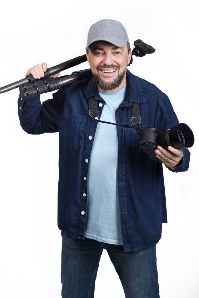 istock Professional photographer with camera and tripod on white background 1985247146