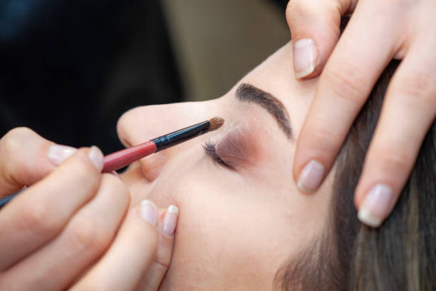 istock Makeup artist apply makeup brush for eyes. 1985248200