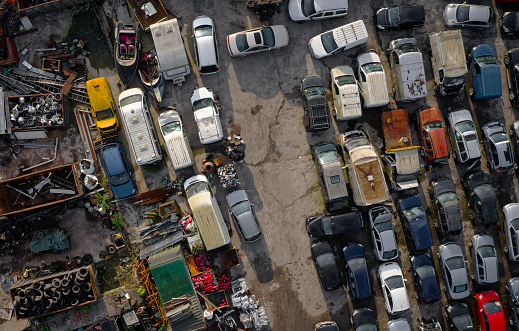 Aerial view of car junkyard. Taken via drone. 4k video.