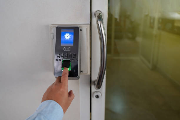 istock Yong business man push down the electronic control machine to access the door 1985250283