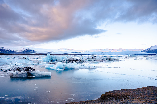 The Glacier Lagoon Jokularlon with mountains and snow in the background
