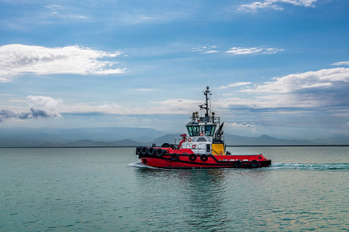 Tugboat leaving port for pilotting.