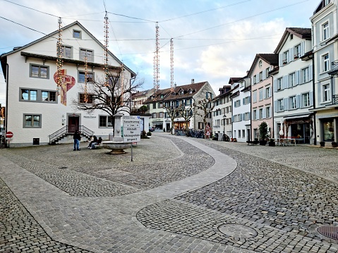 The image shows the historic city of Rapperswil, captured durign winter season.
