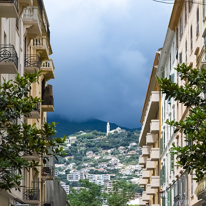 Corsica, Bastia,typical street with the mountain in background