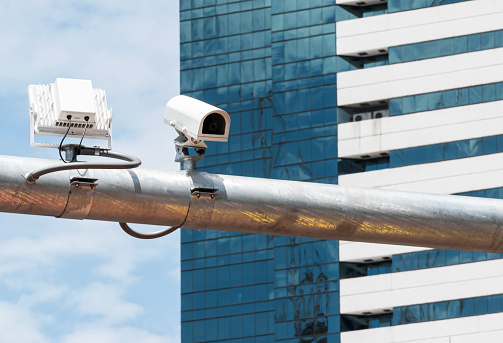 Outdoor white CCTV on pole