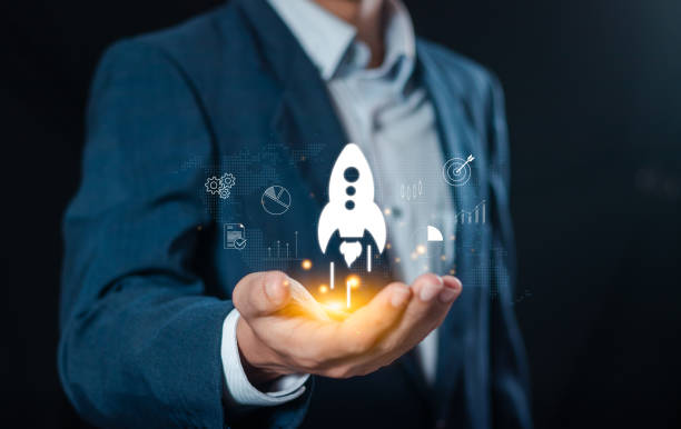 Startup business concept, Businessman holding rocket icon for fast start up business. Plan work strategies and business success