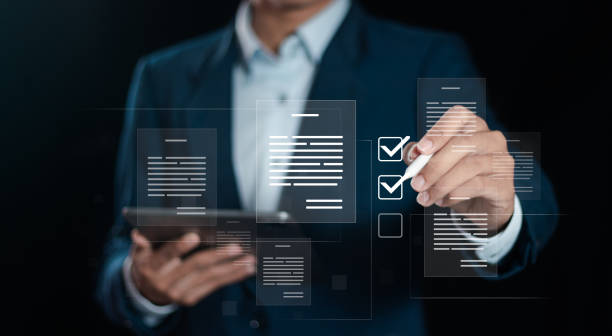 Businessman working on tablet to document management online for checklist and clipboard task management, filling survey form online, answer questions of test. Survey form concept.