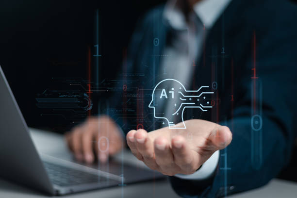 istock AI technology, Businessman use laptop and holding global AI tools for big data network connection by use artificial intelligence technology to help solve work problems. 1985334162