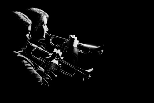 Trumpet players jazz band. Musicians playing trumpet music brass instrument isolated on black