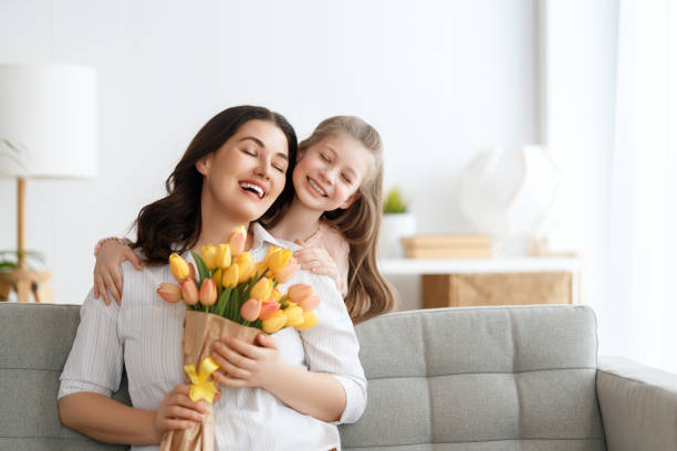 istock daughter and mom with flowers 1985436850