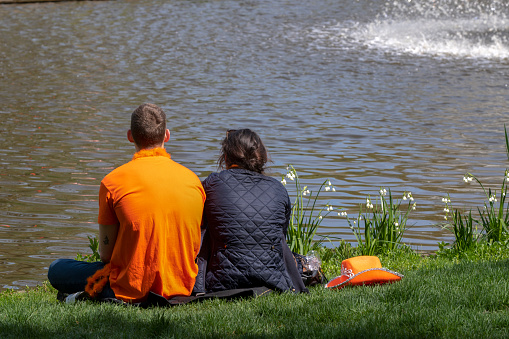 Couple Enjoying The Sun At Kindsday At Amsterdam The Netherlands 27-4-2023