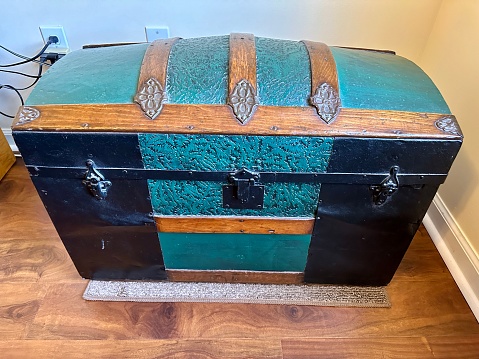 A partially restored early 1900’s streamer trunk.
