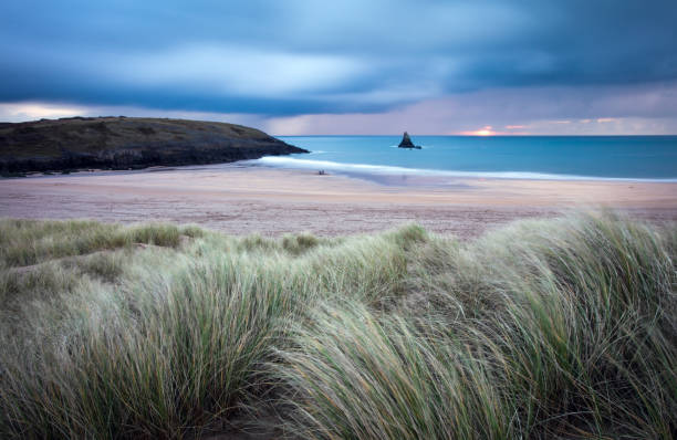 Moody sunrise at South Haven beach in Pembrokeshire national park, Wales