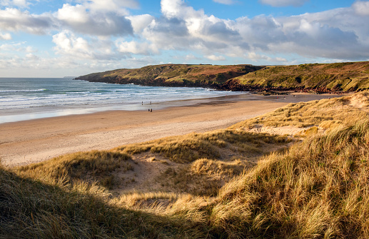 Sand dunes, beach and sunshine at Freshwater West in Pembrokeshire national park, Wales