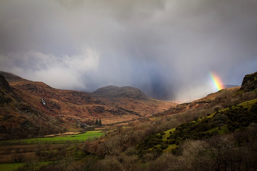 Rainbow amongst storm clouds - Snowdonia national park, Wales