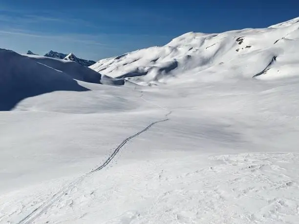 Ski tour on the Pfannenstock mountain in the Schwyz Alps. Backcountry tour in Glarus in a beautiful mountain landscape. Ski mountaineering in Braunwald. Skitouring . High quality photo.