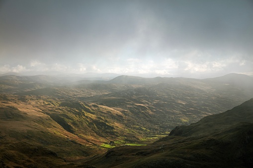 Sun breaks through rain clouds - Snowdonia national park, Wales