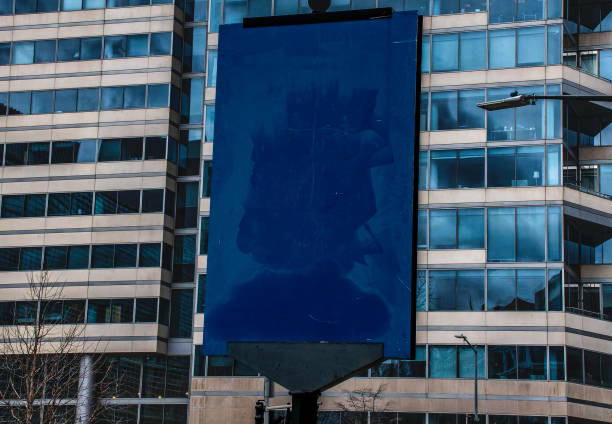 istock A strange blank blue sign in front of a downtown office building 1985471731