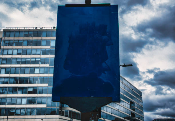 A strange blank blue sign in front of a downtown office building