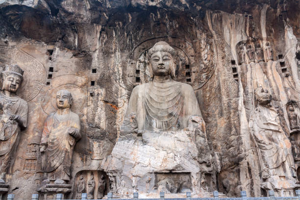 Longmen, China - 31. October 2011: Buddhist statues in Longmen Grottoes. China. This large grotto group was started from 494 AC finished about 644 AC.