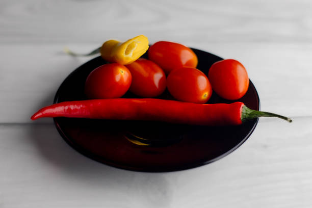 A crate full of freshly picked red organic tomatoes