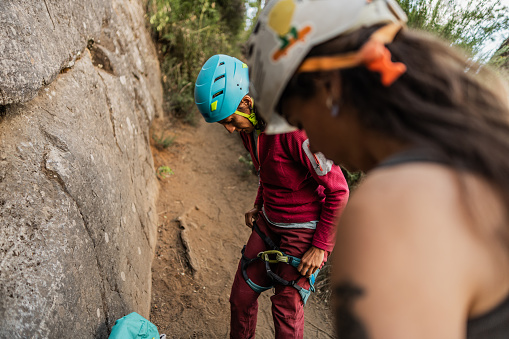 Female climber preparing for cliff climbing