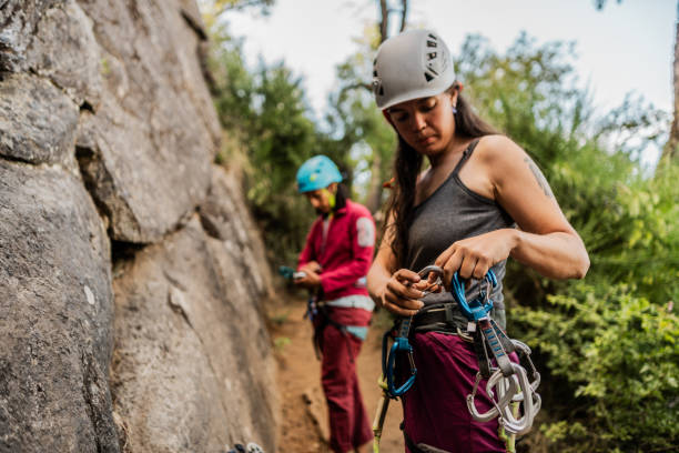 istock Female climber preparing for cliff climbing 1985494838