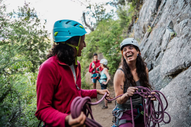 istock Climber friends having fun during climbing outdoors 1985498679