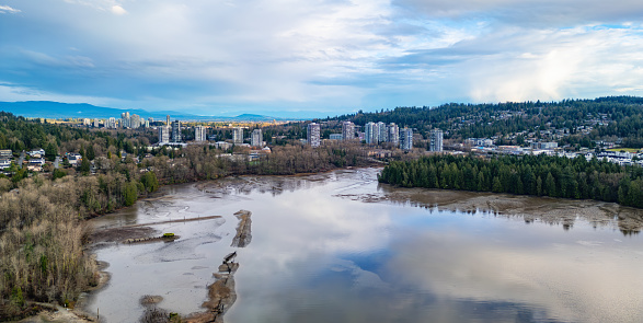 City buildings and homes in suburban city. Aerial View. Port Moody, Vancouver, BC, Canada.