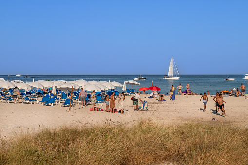 Punta Prima, Spain, June 25, 2023; People enjoy the beach at the small, quiet seaside resort of Punta Prima in the far southeast of Menorca.