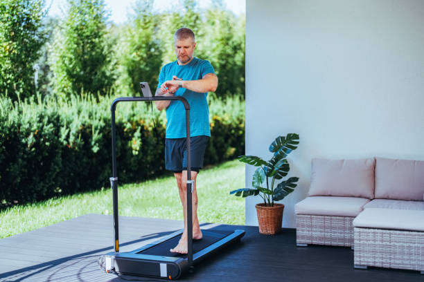 istock Man running on a treadmill at the yard 1985547227