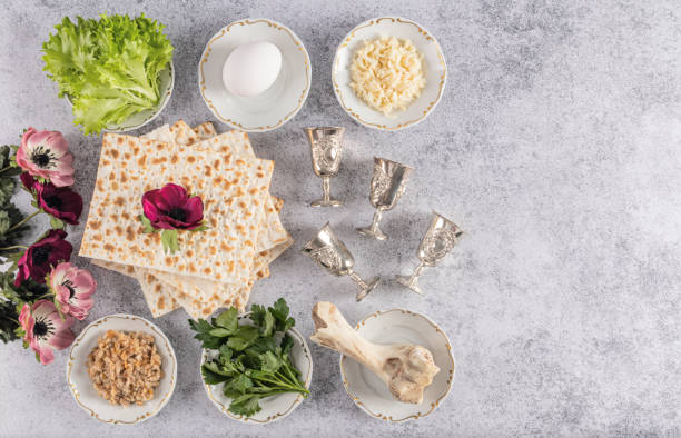 top view of traditional products for the Jewish holiday of Passover, flowers, silver glasses. Marble background. A copy space. postcard. Flat lay. top view of traditional products for the Jewish holiday of Passover, flowers, silver glasses. Marble background. A copy space. postcard. Flat lay passover celebration stock pictures, royalty-free photos & images