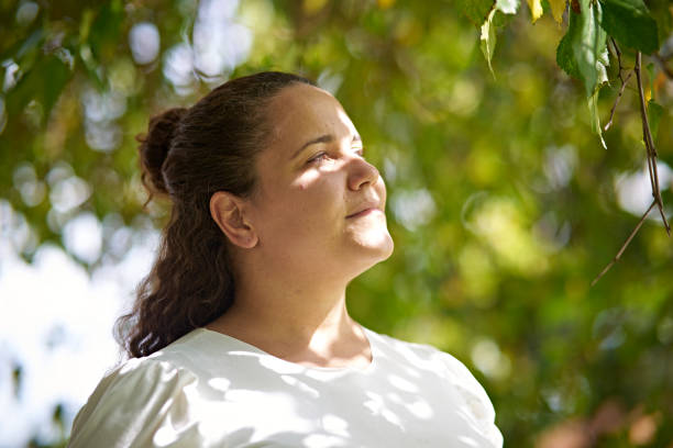 istock Young woman connecting wtith the nature around her 1985603955