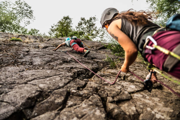 Female climber climbing mountain